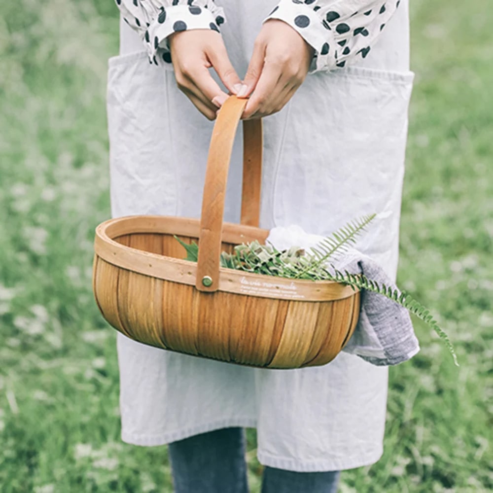 Oval woven wood chip basket with bentwood handle