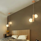 Light wood pendant with two frosted glass globes