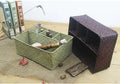 Woven rectangular organizer with four compartments holding toiletries