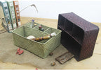 Woven rectangular organizer with four compartments holding toiletries
