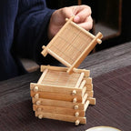 Small hand woven bamboo coaster for a glass
