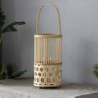 Hand woven natural bamboo lantern casting graphic patterns