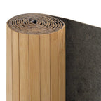 Wide room divider with woven bamboo slats in warm natural tones