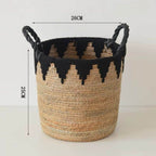 Woven basket with black zigzag pattern and black handles