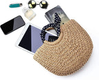 Hand woven beach bag with a knotted navy and white polka dot scarf handle