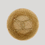 Woven belly basket with green and white tassels holding flowers