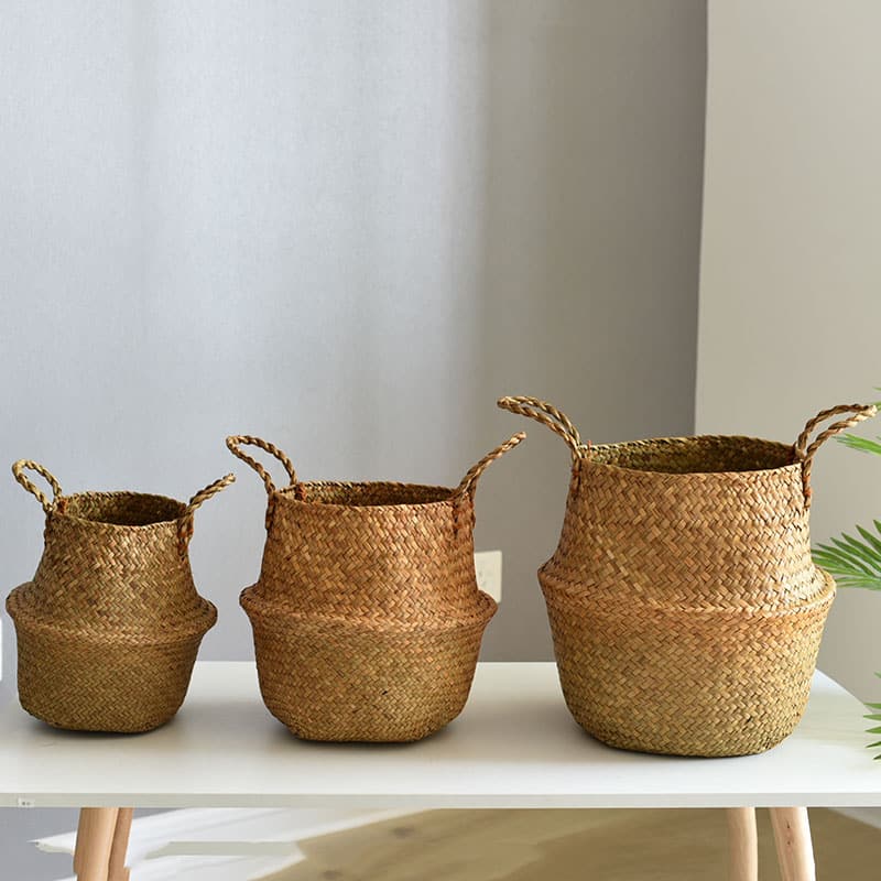 Woven belly plant baskets holding ferns
