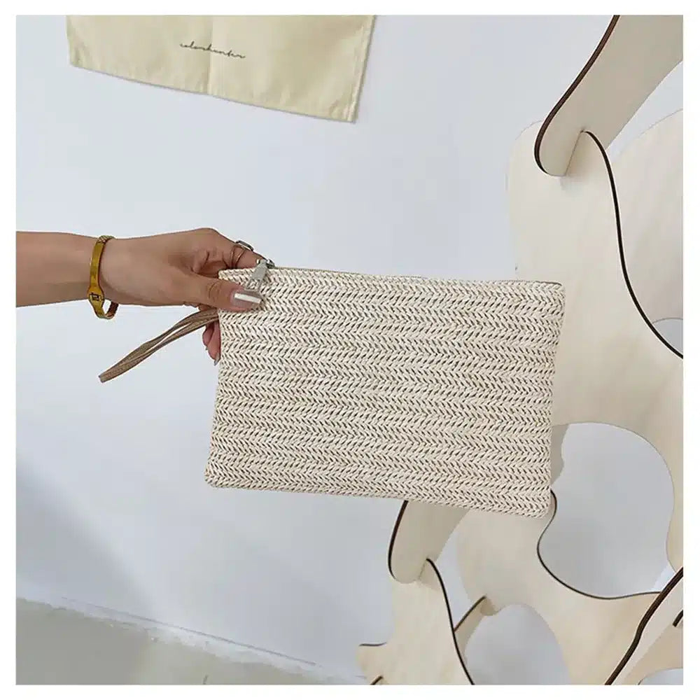 Compact beige woven clutch with a brown shoulder and wrist strap