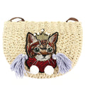 Woven clutch with a cat motif worked into the weave and a zip