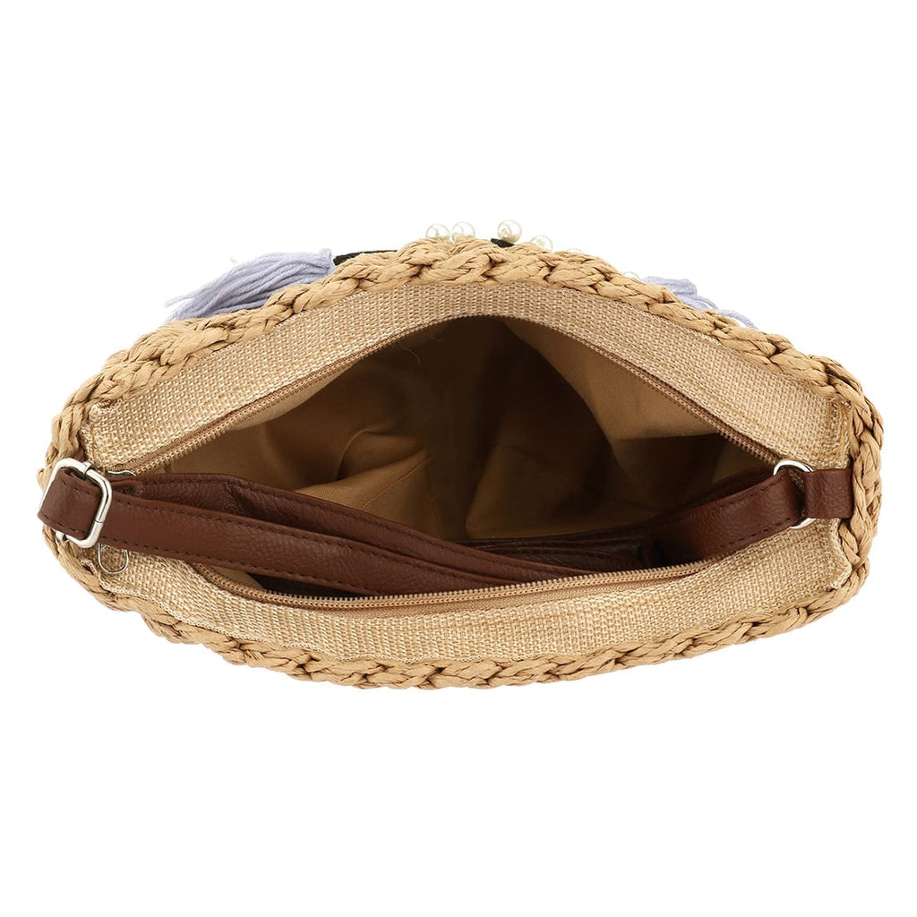 Woven clutch with a cat motif worked into the weave and a zip