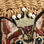 Woven clutch with a cat motif worked into the weave and a zip