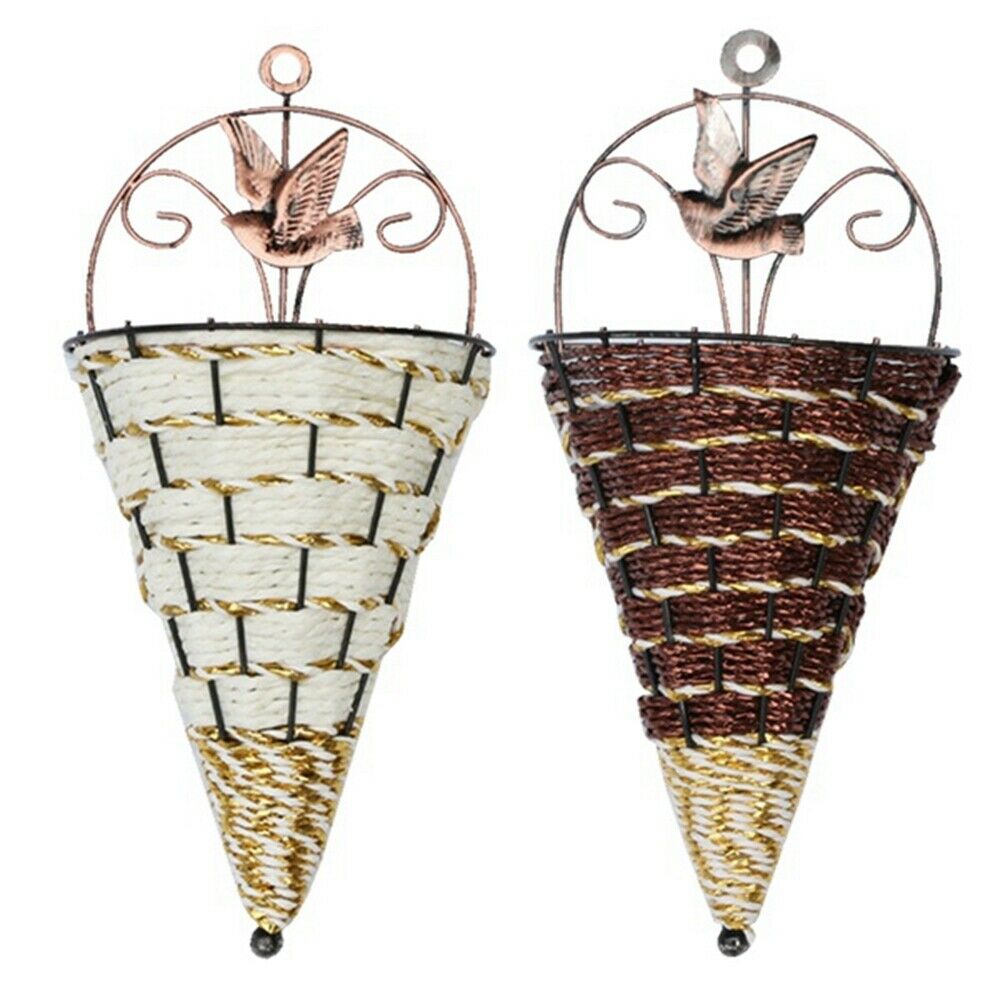 Woven cone shaped wall planter filled with pink flowers