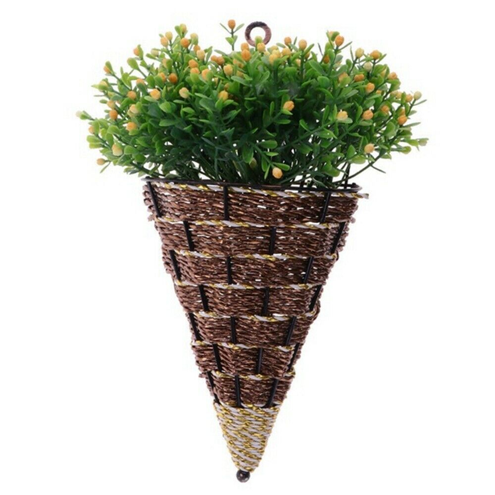 Woven cone shaped wall planter filled with pink flowers