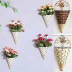 Woven cone shaped wall planter filled with pink flowers