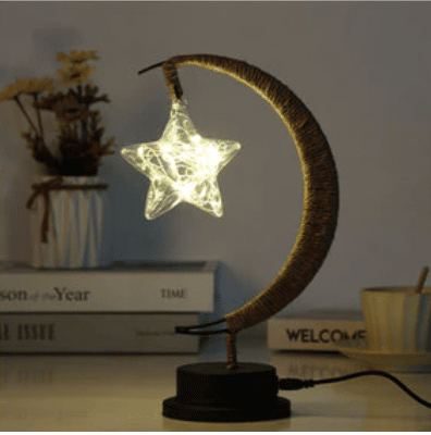 Woven crescent moon shaped USB lamp with a star shaped bulb