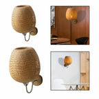 Two woven egg shaped wall sconces on curved arms