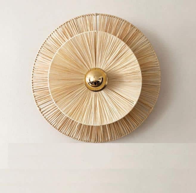 Round woven flower wall sconce with a brass center