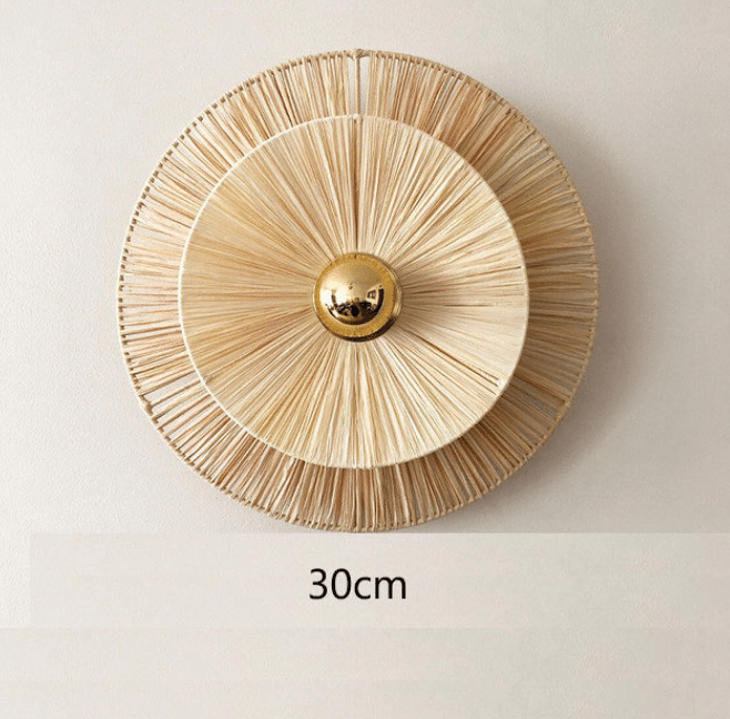 Round woven flower wall sconce with a brass center