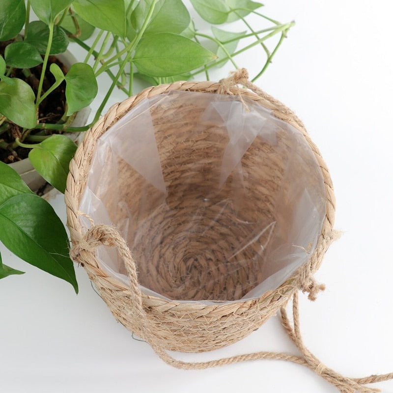 Hanging planter knotted in natural jute rope macrame