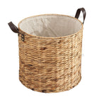 Round woven laundry basket with leather look handles and liner