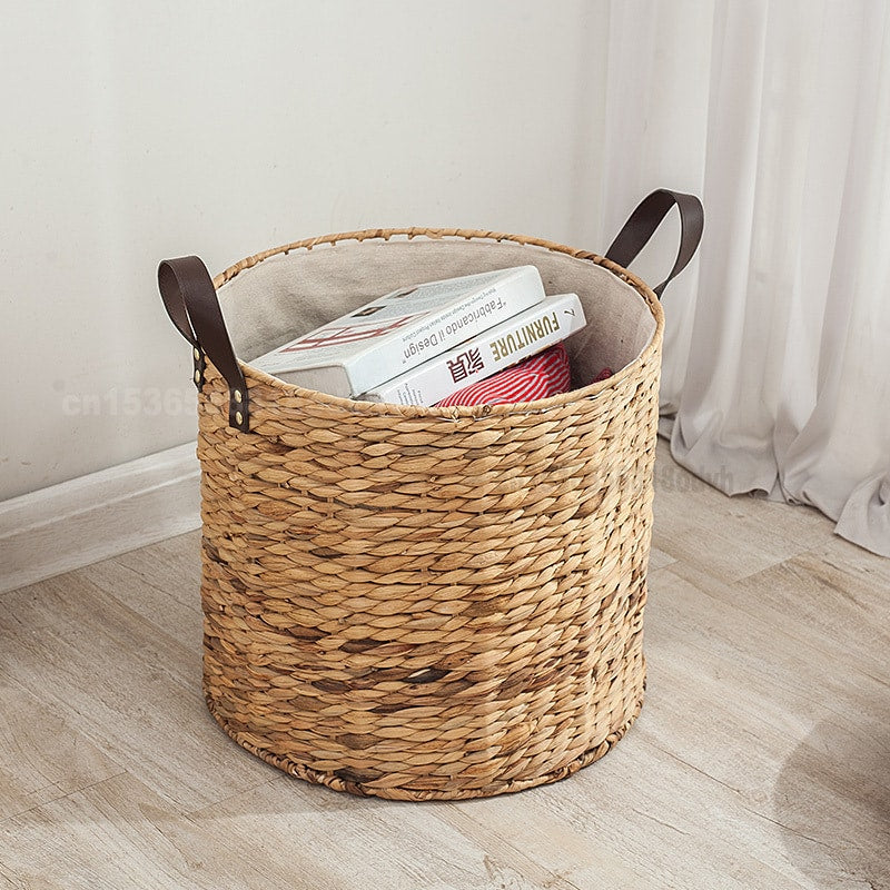 Round woven laundry basket with leather look handles and liner