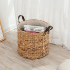 Round woven laundry basket with leather look handles and liner