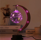 Crescent moon lamp with a hand woven hemp frame and a round blush pink globe
