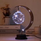 Crescent moon lamp with a hand woven hemp frame and a round silver bulb
