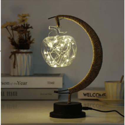 Crescent moon lamp with a hand woven hemp frame and an apple shaped bulb