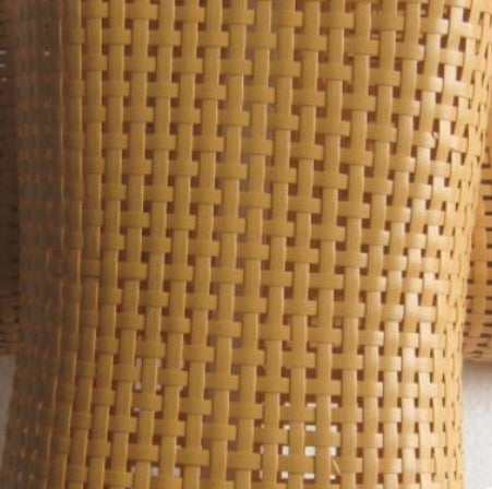 Brown hand woven PE rattan neck cushion with a curved shape