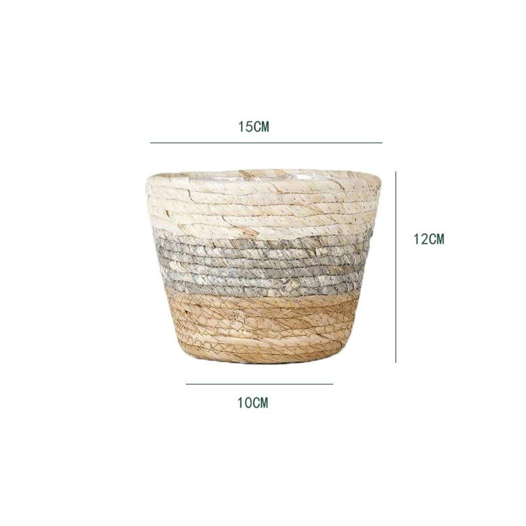 Woven plant pot covers with liners holding green plants
