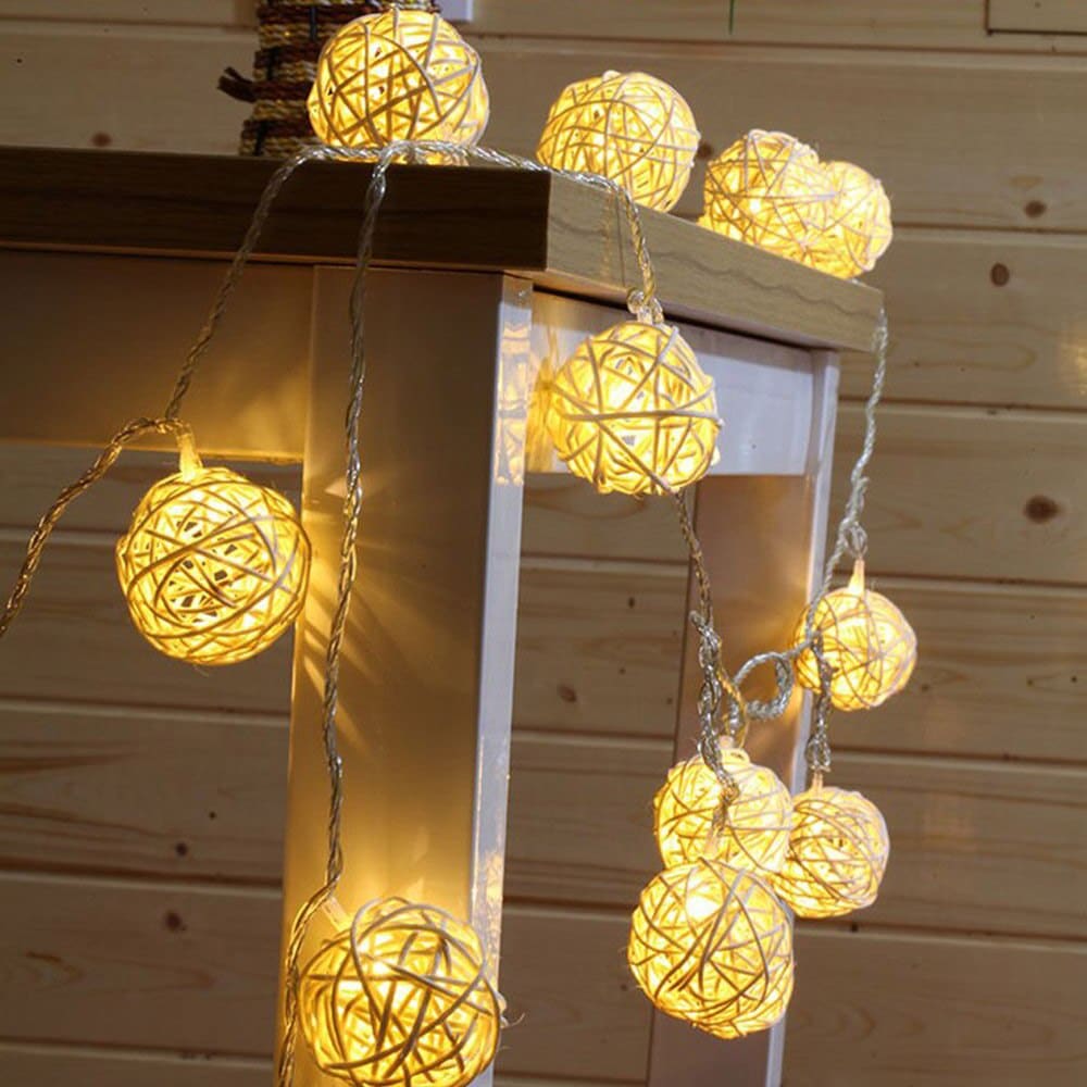 Battery powered string lights with small hand woven rattan balls