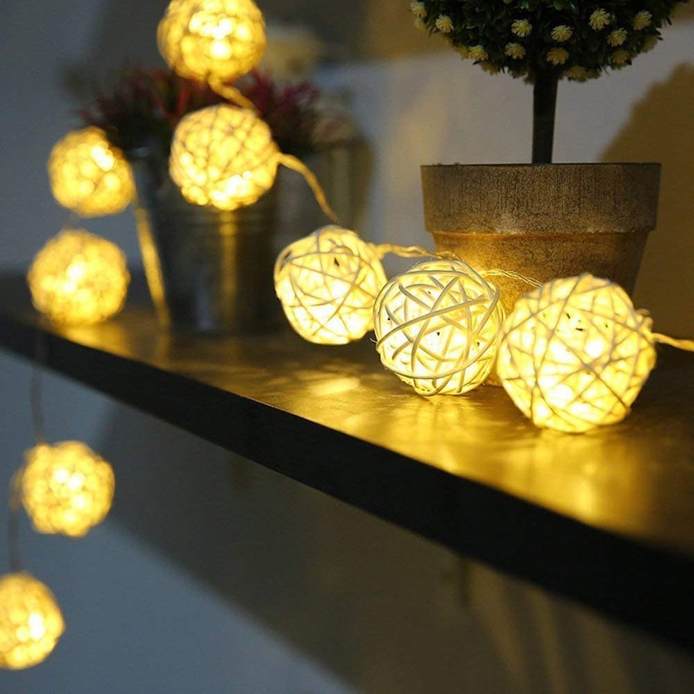 Battery powered string lights with small hand woven rattan balls