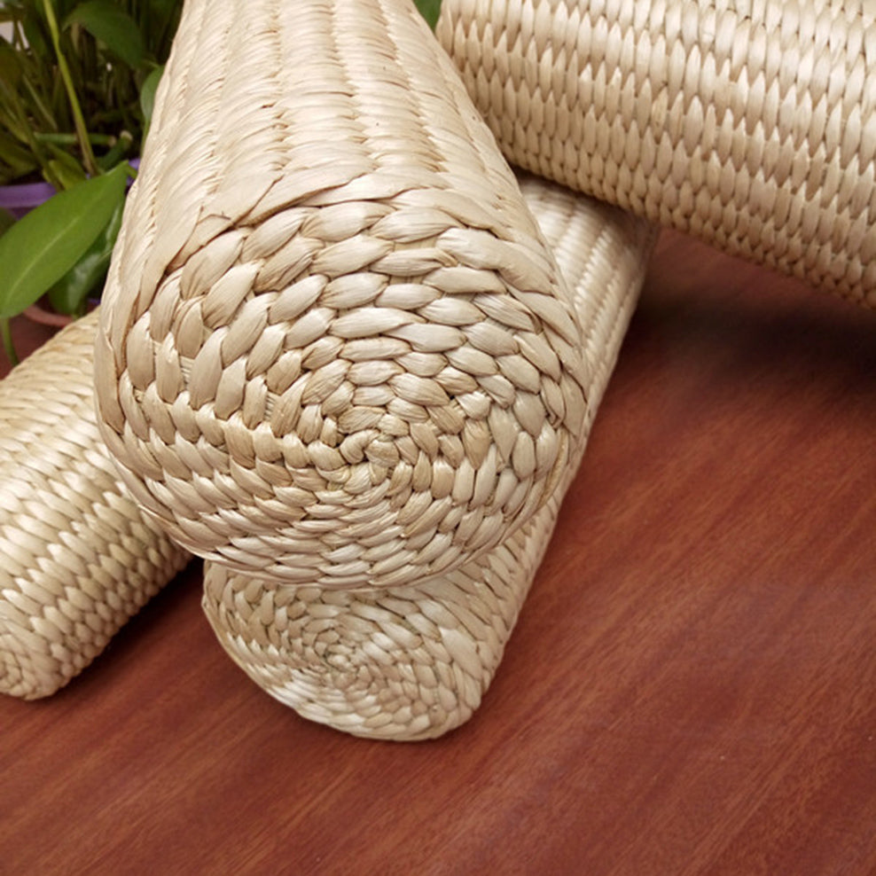 Cylindrical bolster cushion tightly hand woven in light rattan