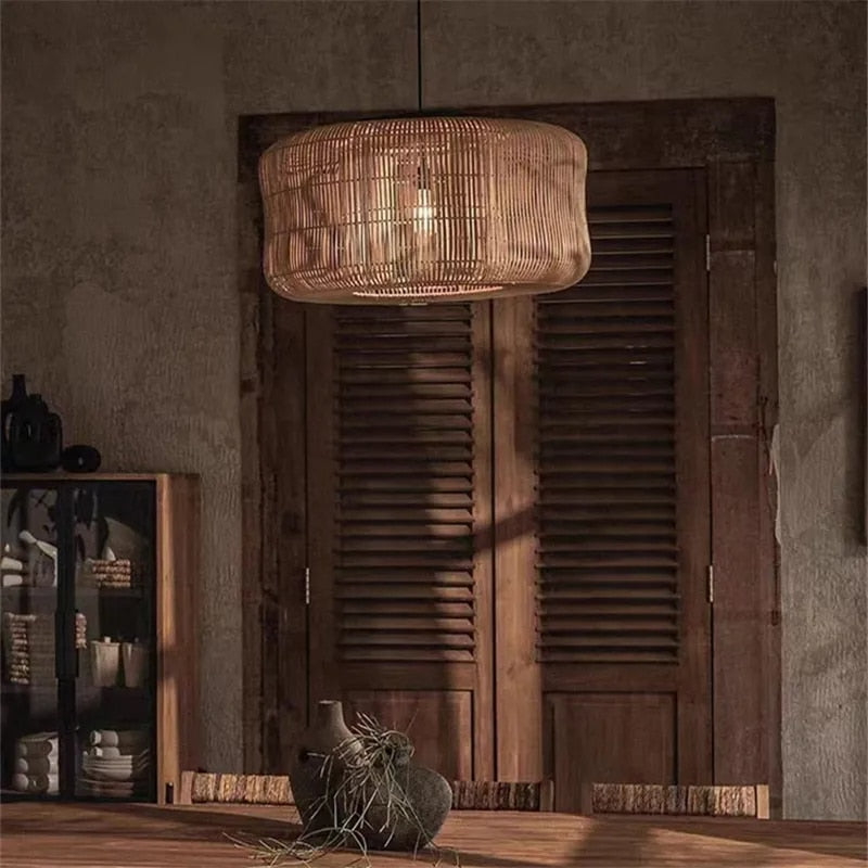 Woven rattan drum pendant light hung in a rustic room
