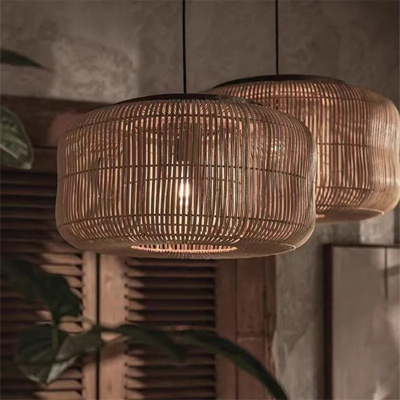 Woven rattan drum pendant light hung in a rustic room