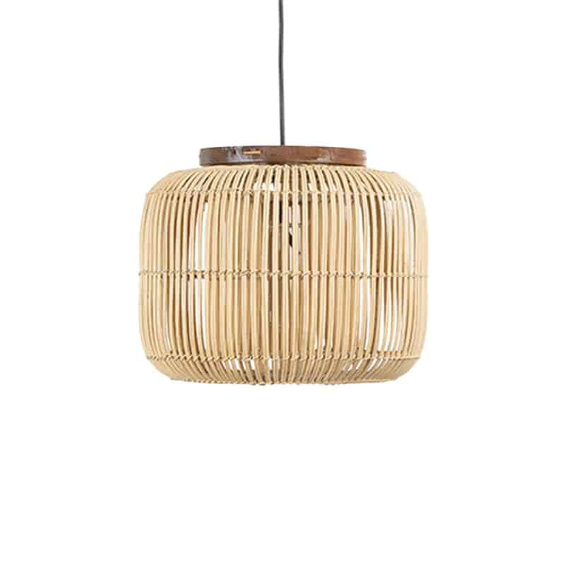 Woven rattan drum pendant light hung in a rustic room