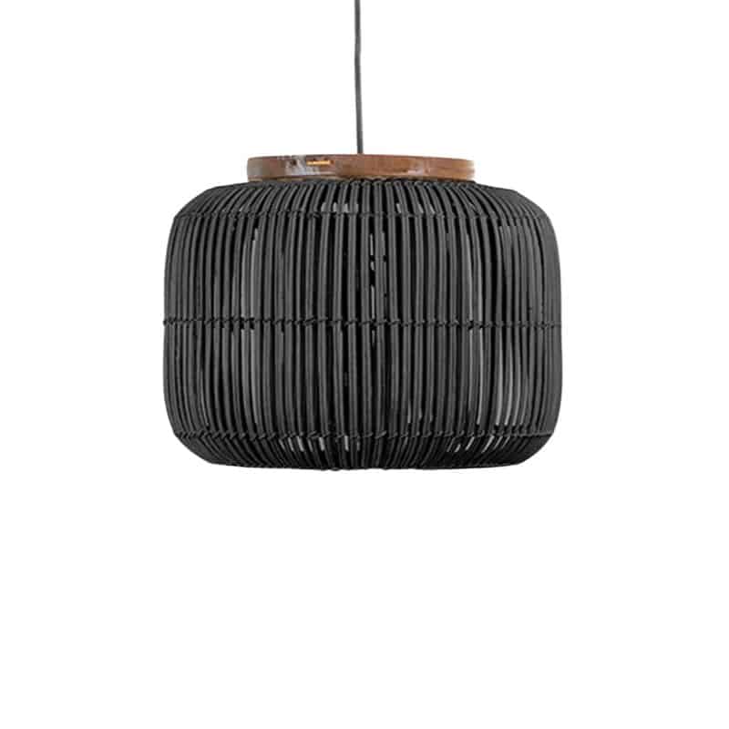 Woven rattan drum pendant light hung in a rustic room