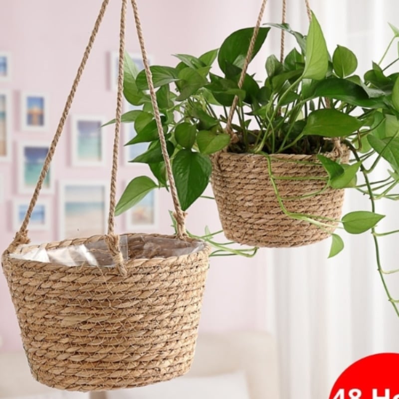 Hand woven rattan hanging planter for a balcony or pergola