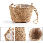 Hand woven rattan hanging planter for a balcony or pergola