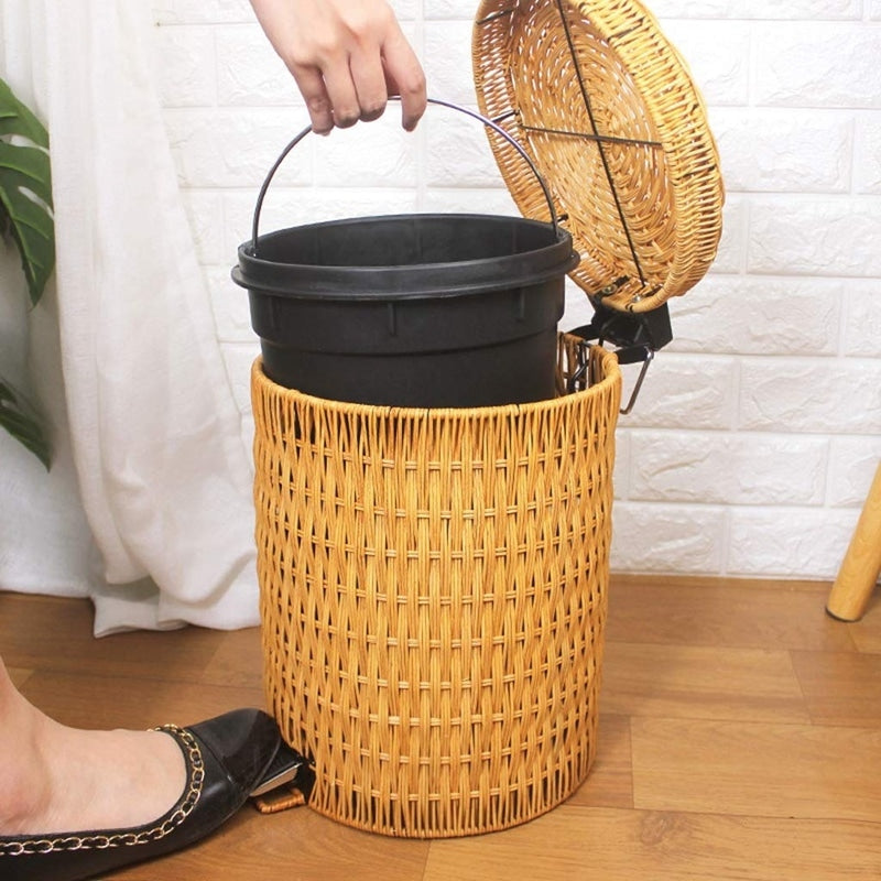 Woven rattan trash can with a foot pedal and a lid
