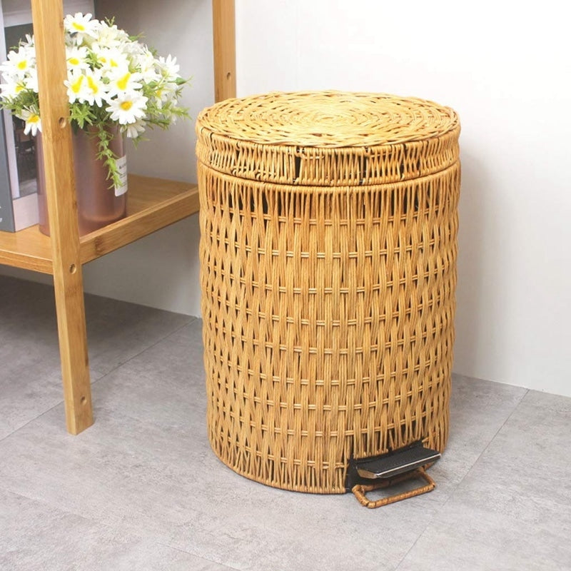 Woven rattan trash can with a foot pedal and a lid