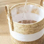 Round hand woven rattan planter with a white painted band