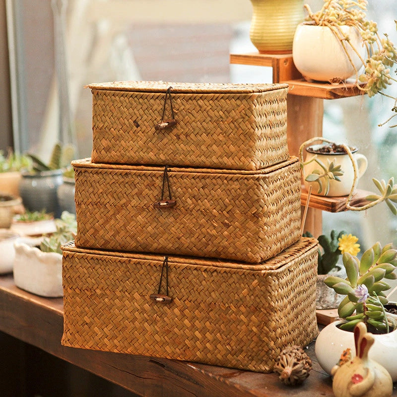 Rectangular woven rattan storage box with a lid, latch and side handles