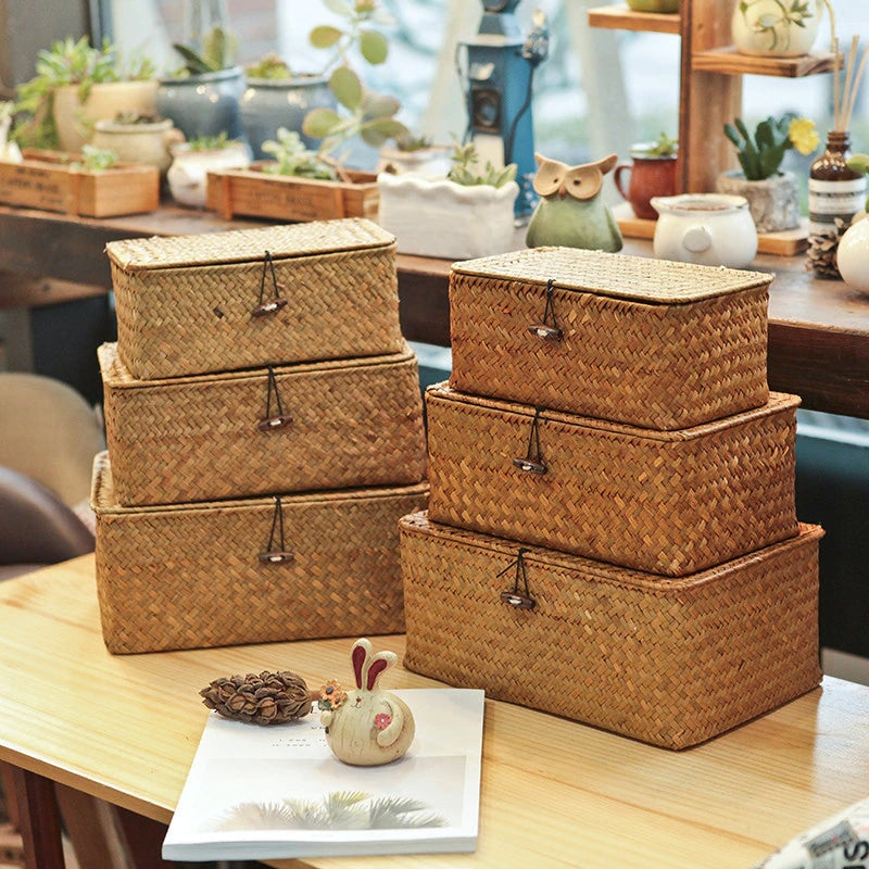 Rectangular woven rattan storage box with a lid, latch and side handles