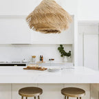 Woven rattan pendant light with three lights and a metal frame