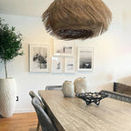 Woven rattan pendant light with three lights and a metal frame