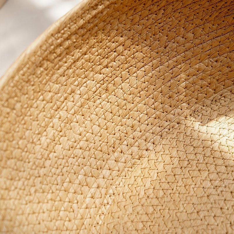 Round woven dog bed with a low front entry
