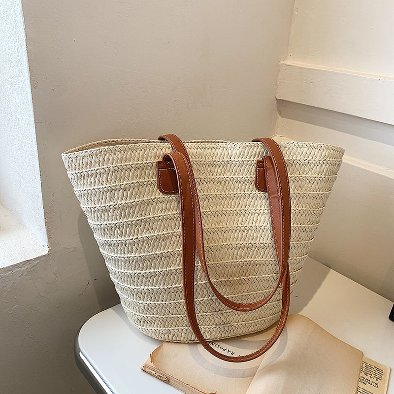Structured woven straw bag with wide shoulder handles in beige or brown