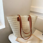 Structured woven straw bag with wide shoulder handles in beige or brown